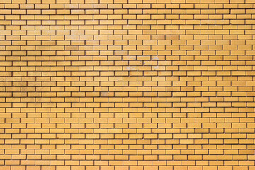 A large ginger coloured brick wall texture