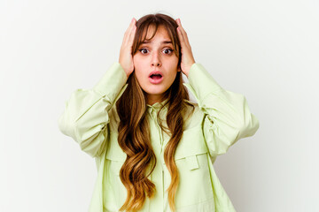 Fototapeta premium Young caucasian cute woman isolated on white background being shocked, she has remembered important meeting.