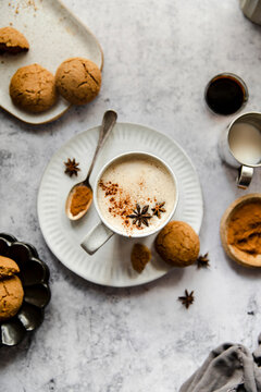 Gingerbread latte with gingersnap cookie.