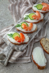 Bruschetta with creamy ricotta shrimp and cucumber. A healthy, nutritious snack.