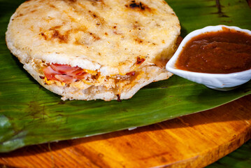 Colombian arepa stuffed with assorted meat and cheese