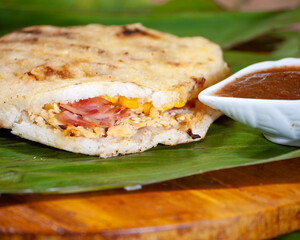 Colombian arepa stuffed with assorted meat and cheese