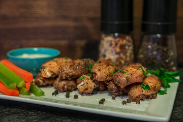 Salt and Pepper Chicken Wings on a White Plate