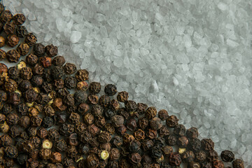 Salt and Pepper whole spices beside each other