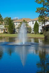 Wandcirkels Foto's A beautiful clear blue community pond or lake  © Feng