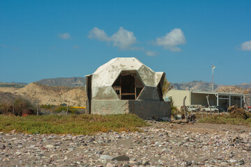 old house on the seashore in a hexagonal shape.