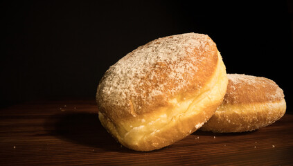 Close up view over fresh baked doughnuts - macro shot