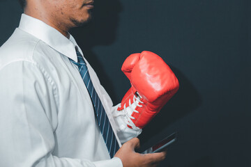 Concept of business competition Businessman standing in red boxing gloves, success in uncle...