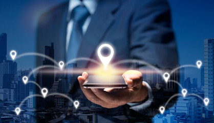 Man hold smart Phone connect to GPS location icon show global business, direction, travel, 5G concept. Businessman use internet network on mobile phone find location in the city by GPS Navigator Map.