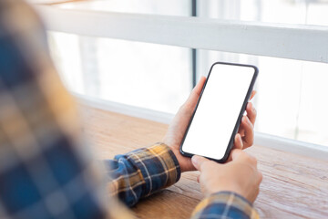 cell phone blank white screen mockup.woman hand holding texting using mobile on desk at office.background empty space for advertise.work people contact marketing business,technology