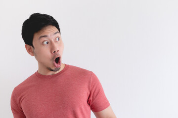Wow and shocked face of funny Asian man isolated on white background.