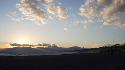 sunset over the mountains ocean view