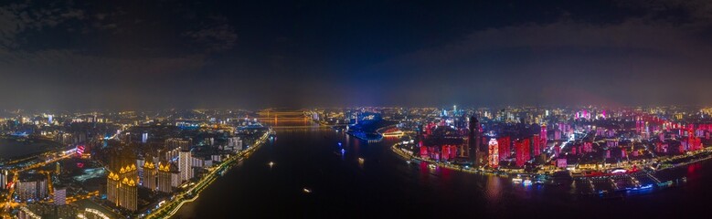 Fototapeta na wymiar wuhan light show.Panoramic skyline and buildings beside yangtze river.