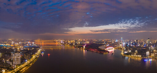 wuhan light show.Panoramic skyline and buildings beside yangtze river.