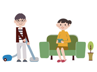 夫が部屋を掃除機で掃除する