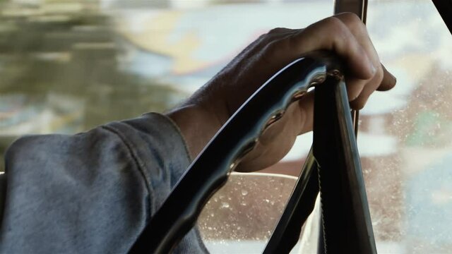 Male Hands On Steering Wheel in an Old Pickup Truck. Close-Up. 4K Resolution.