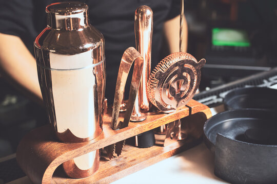A view of a set of copper bartender supplies on the counter.