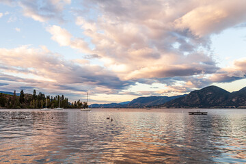 Fototapeta premium beautiful calm lake in British Columbia Canada early morning clouds on sky