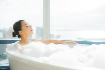 Portrait beautiful young asian woman relax enjoy in bathtub - 417275740