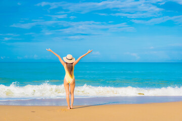 Portrait beautiful young asian woman relax smile leisure around outdoor sea beach ocean