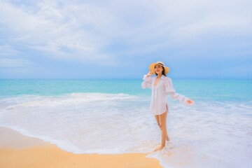 Fototapeta na wymiar Portrait beautiful young asian woman relax leisure smile around beach sea ocean