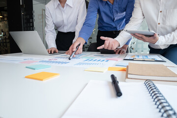 business man and woman meeting conference in office. Professional people group working and discuss strategy data documents on office table. Business planning and brainstorming concept.