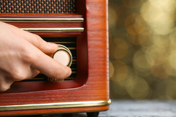 Man switching on a radio