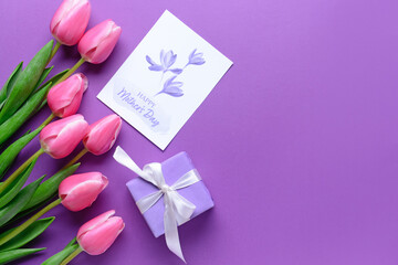 Beautiful flowers, gift and greeting card for Mother's Day on color background