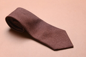 Stylish necktie on color background