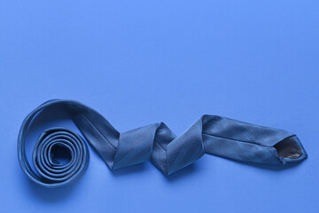 Stylish necktie on color background