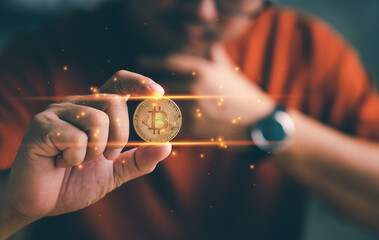 Business and Finance, Savings, Investing with Digital Assets, Future finance, Bitcoin in hand of a casual businessman wondering what the future is.