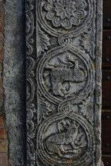Moscufo - Abruzzo - Abbey of Santa Maria del Lago - Side detail of the portal with flat relief elements.