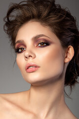 Portrait of beautiful woman with evening makeup