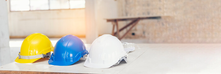 Construction hard hat safety tools equipment for workers in construction site for engineering protection head standard. Many hard hat helmet on row with copy space. Engineering Construction Concept