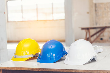 Construction hard hat safety tools equipment for workers in construction site for engineering protection head standard. Many hard hat helmet on row with copy space. Engineering Construction Concept