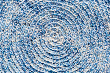 Fototapeta na wymiar Crochet texture of handmade, a close-up of a blue knitting pattern