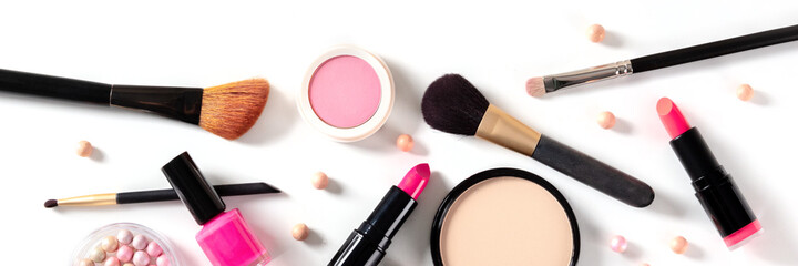 Makeup panorama, overhead flat lay shot with brushes, pearls and other products on a white...
