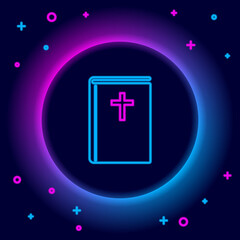 Fototapeta premium Glowing neon line Holy bible book icon isolated on black background. Colorful outline concept. Vector.