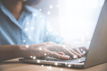 Businesswoman working on laptop online social media networking.