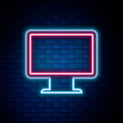 Glowing neon line Computer monitor screen icon isolated on brick wall background. Electronic device. Front view. Colorful outline concept. Vector.