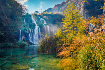 Landscape photography. Sunny morning view of pure water waterfall in Plitvice National Park....