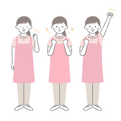 ガッツポーズをする介護ヘルパー／保育士　女性