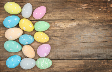 Fototapeta na wymiar Painted Easter eggs lying on a wooden background