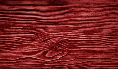 A fragment of red wooden plank