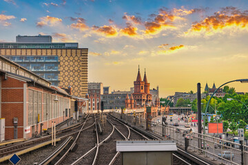 Naklejka premium Berlin Germany, sunset city skyline at Oberbaum Bridge and Berlin Metro