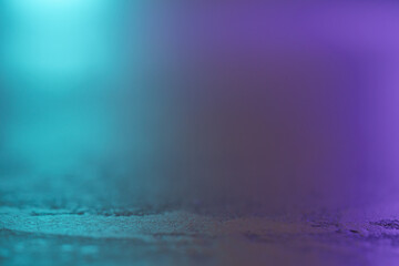 macro shot of decorative concrete surface with cyan and purple light