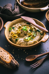 Arabic Aubergine paste or dip Baba Ghanoush with olives and sesame seeds