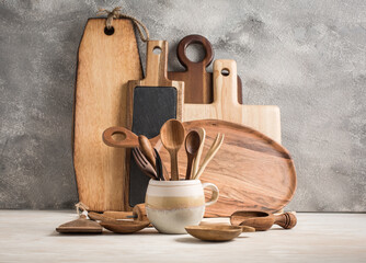 Assortment of wooden cutting boards and kitchen utensils