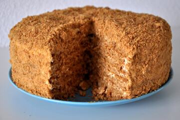 Honey Homemade Cake on Blue Plate on the Table