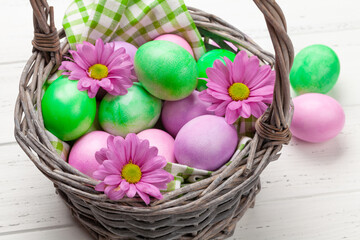 Easter greeting card with colorful easter eggs and flowers